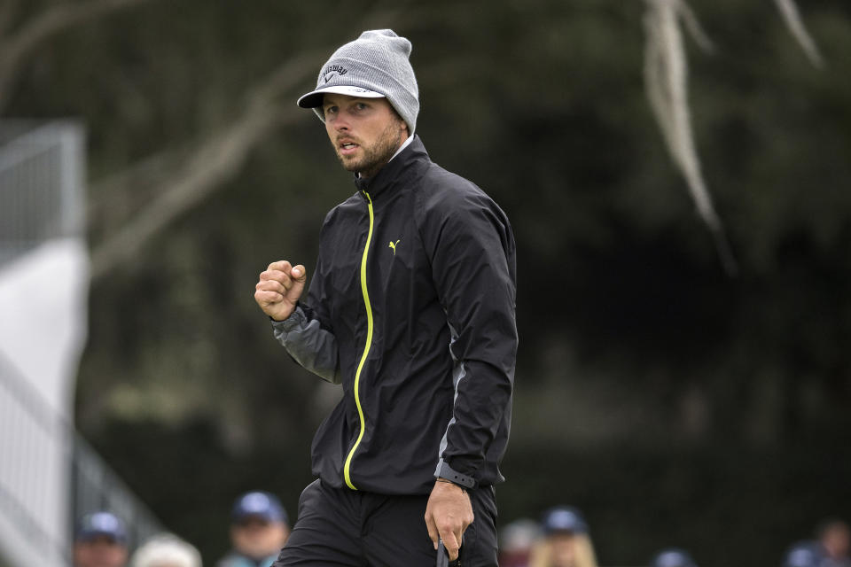 Adam Svensson, of Canada, celebrates his par putt on the 18th green during the final round of the RSM Classic golf tournament, Sunday, Nov. 20, 2022, in St. Simons Island, Ga. (AP Photo/Stephen B. Morton)