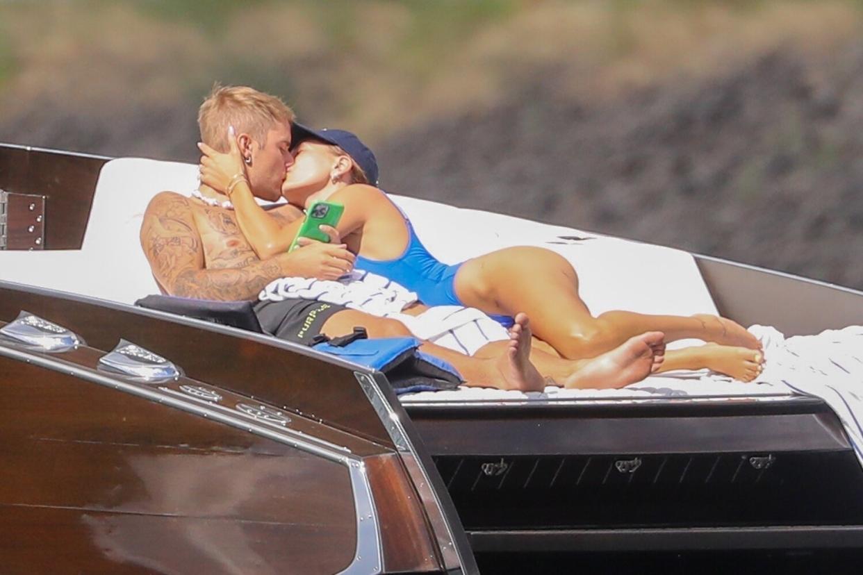 *PREMIUM-EXCLUSIVE* - As long as you love me. Justin and Hailey put on a very sweet loved up display as they lounge on a boat stern during ride on the lake in Couer d’Alene