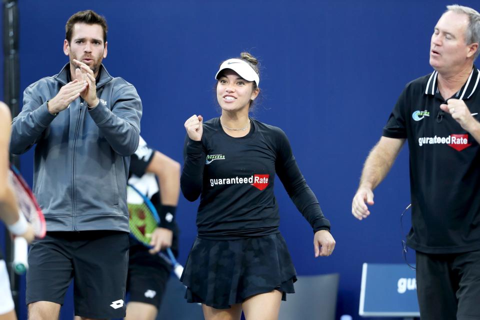 Orange County Breakers' teammates Austin Krajicek, left, Desirae Krawczyk and coach Rick Leach celebrate a point during the World TeamTennis finals at the Indian Wells Tennis Garden in Indian Wells, Calif., on November 28, 2021.