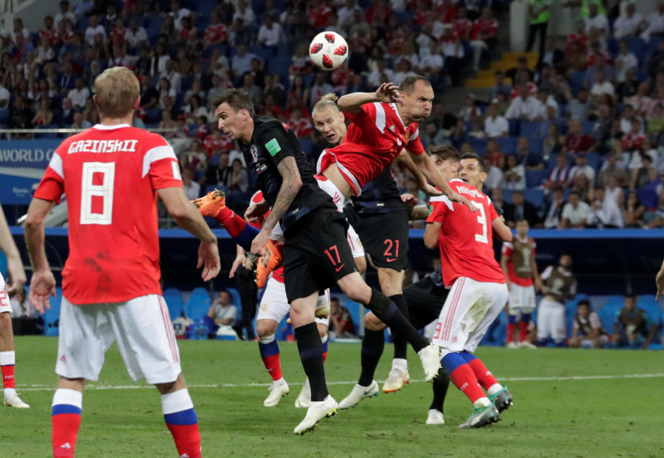 <p>Croatia’s Domagoj Vida heads the ball at goal before Vedran Corluka (not pictured) scores their second goal to put them 2-1 up in extra time </p>