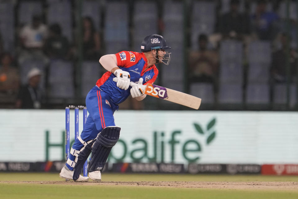 Delhi Capitals' David Warner plays a shot during the Indian Premier League (IPL) match between Delhi Capitals and Mumbai Indians in New Delhi, India, Tuesday, April 11, 2023. (AP Photo/Manish Swarup)