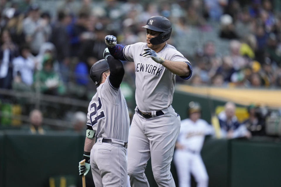 New York Yankees' Giancarlo Stanton, right, celebrates with Harrison Bader after hitting a solo home run against the Oakland Athletics during the fourth inning of a baseball game in Oakland, Calif., Wednesday, June 28, 2023. (AP Photo/Godofredo A. Vásquez)