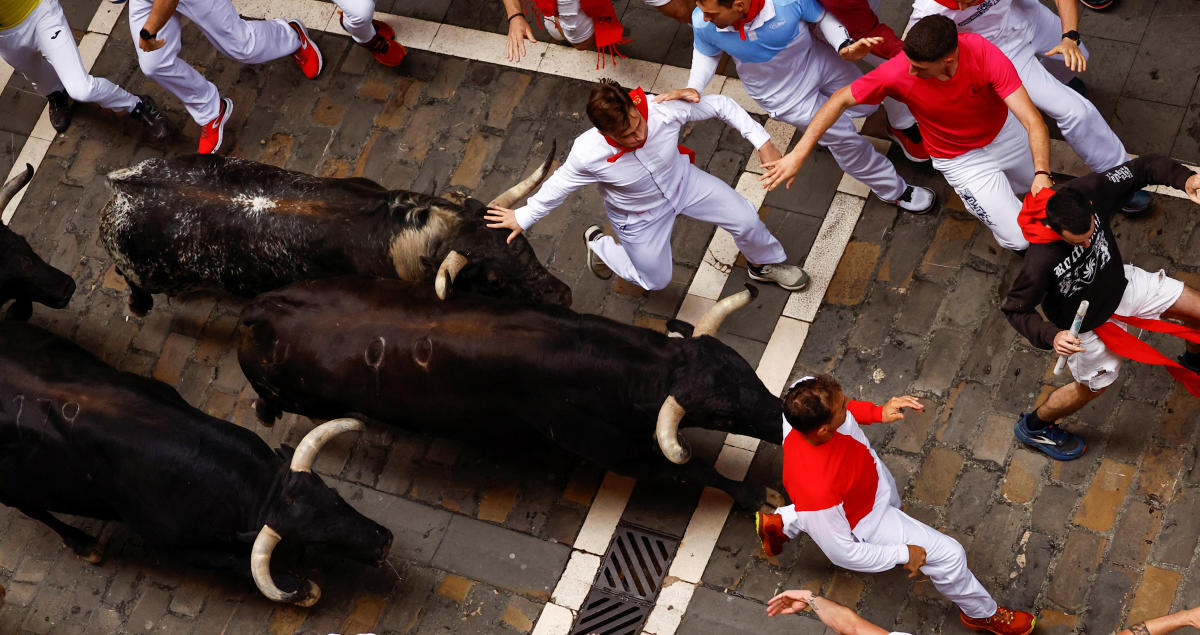 Bulls charge through Pamplona's controversial festival See the