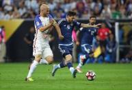 Jun 21, 2016; Houston, TX, USA; Argentina midfielder Lionel Messi (10) pushes the ball down the field as United States midfielder Michael Bradley (4) defends during the first half in the semifinals of the 2016 Copa America Centenario soccer tournament at NRG Stadium. Troy Taormina-USA TODAY Sports