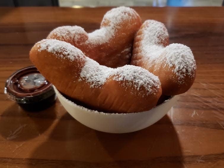 bowl of mickey mouse shaped beignets from disney's port orleans french quarter resort 