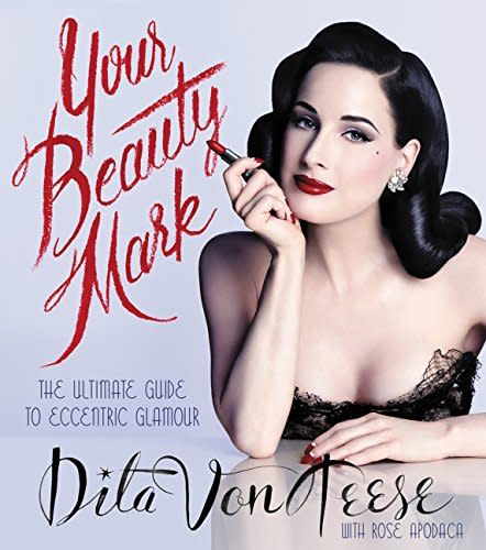 <p>Learn all of the burlesque star’s beauty secrets (her beauty mark is a tattoo, she wears gloves in the car to keep her fair skin protected) as well as tips of your own (how to master a cat eye and get an hourglass figure through exercise). If you love old Hollywood glamour or are still figuring out your signature look, this insightful guide will teach you everything. <a href="http://www.amazon.com/Your-Beauty-Mark-Dita-Teese/dp/0060722711/ref=sr_1_336?s=books&ie=UTF8&qid=1449253803&sr=1-336&keywords=beauty+book" rel="nofollow noopener" target="_blank" data-ylk="slk:“Your Beauty Mark” by Dita Von Teese;elm:context_link;itc:0;sec:content-canvas" class="link ">“Your Beauty Mark” by Dita Von Teese </a>($25)</p>