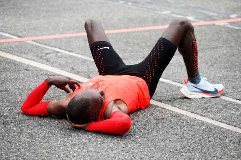 FILE PHOTO: Kipchoge reacts after crossing the finish line during an attempt to break the two-hour marathon barrier at the Monza circuit.