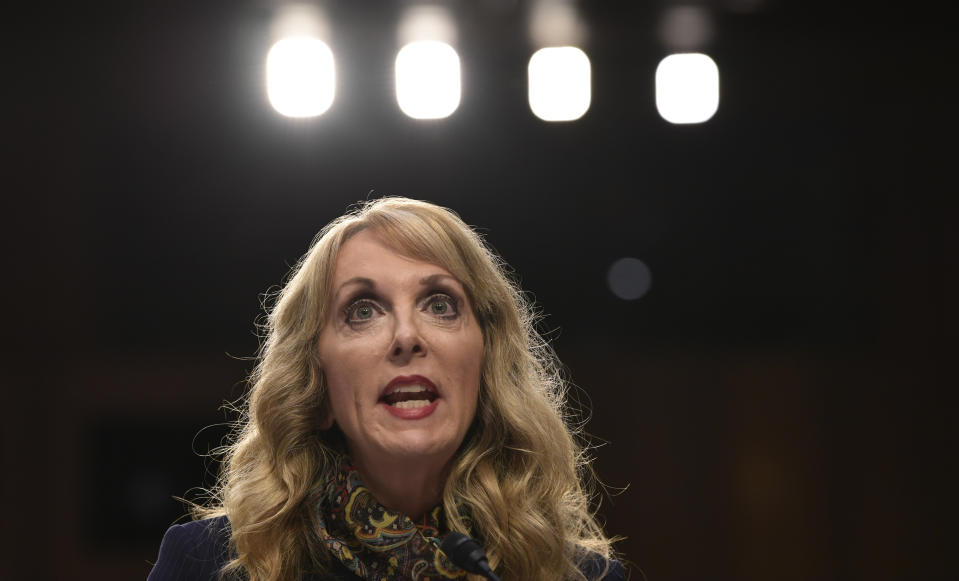 FILE - In this July 24, 2018, file photo, Kerry Perry, president of USA Gymnastics, speaks during a Senate Commerce subcommittee hearing in Washington. The new CEO of the U.S. Olympic Committee is calling for another shakeup in the leadership at USA Gymnastics in the wake of the Larry Nassar sex-abuse scandal. Sarah Hirshland sent out a statement shortly after the gymnastics federation fired Mary Lee Tracy on Friday, Aug. 31, only three days after it hired her as elite program coordinator. Hirshland said the USOC will discuss possible changes with the USA Gymnastics board over the weekend. It likely spells trouble for Perry, who took over as president of USA Gymnastics in November 2017. (AP Photo/Susan Walsh, File)