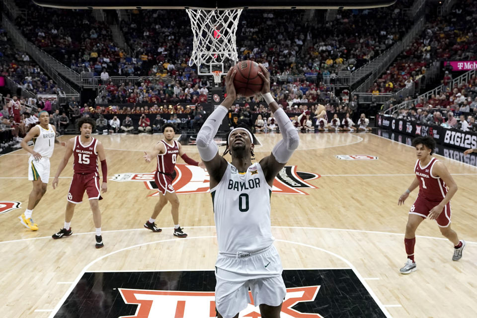 Baylor forward Flo Thamba puts up a shot during the second half of an NCAA college basketball game against Oklahoma in the quarterfinal round of the Big 12 Conference tournament in Kansas City, Mo., Thursday, March 10, 2022. Oklahoma won 72-67. (AP Photo/Charlie Riedel)