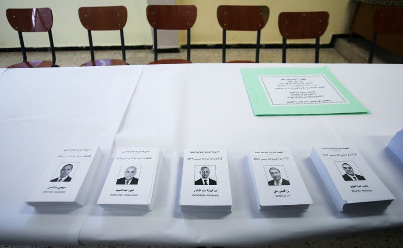 Ballot papers of the five presidential candidates are displayed at a polling station in Algiers