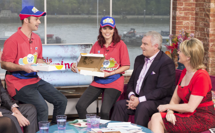 Current presenters feeding Eamonn Holmes some pizza (REX)