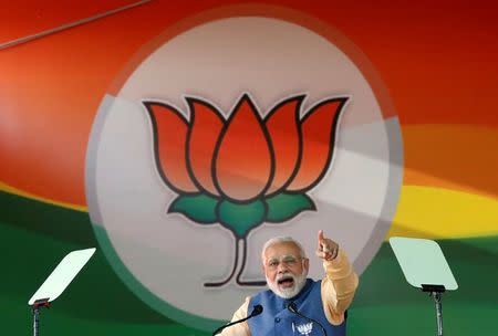 Prime Minister Narendra Modi addresses an election campaign rally ahead of the Karnataka state assembly elections in Bengaluru, India, February 4, 2018. REUTERS/Abhishek N. Chinnappa/Files