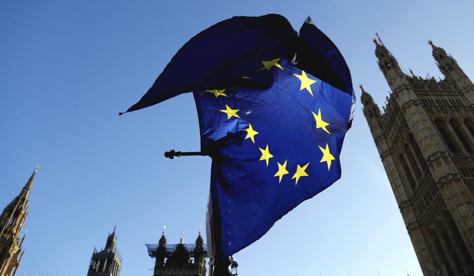 A European flag flies opposite the Houses of Parliament as Pro-European demonstrators protest in London, Monday, Jan. 14, 2019. British Prime Minister Theresa May planned to tell lawmakers Monday that she has received further assurances about her Brexit deal from the European Union, in a last-ditch attempt to stave off a crushing defeat for the unpopular agreement. (AP Photo/Frank Augstein)