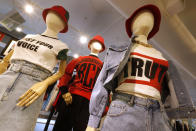 In this Feb. 20, 2020, photo, items from H&M’s new street wear collection are displayed at a store in New York. The collection was designed in collaboration with Ruth Carter, the Academy-Award winning designer behind the costumes for films such as “Black Panther” and “Malcolm X." It debuted as more companies and brands are getting into the business of Black History Month but also trying not to leave the impression that African American consumers are important just once a year. (AP Photo/Richard Drew)