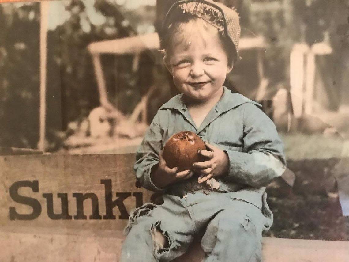 A young John O. Kirkpatrick is pictured in this photo. The image won a Sunkissed photo contest, making the future farmer a literal poster boy for citrus.