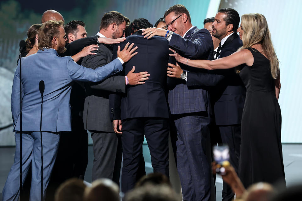 Damar Hamlin of the Buffalo Bills presents the Pat Tillman Award for Service to the trainers of the Bills at the ESPY awards in Los Angeles on Wednesday. (ABC)