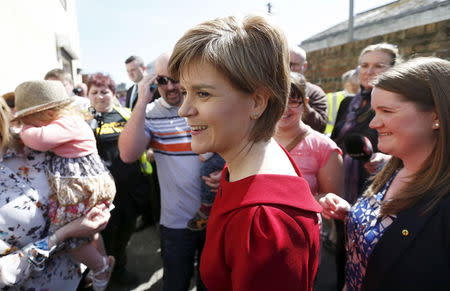 Scottish National Party (SNP) leader Nicola Sturgeon greets supporters during a campaign visit to in Ayr, Scotland, in this April 21, 2015 file photo. REUTERS/Russell Cheyne