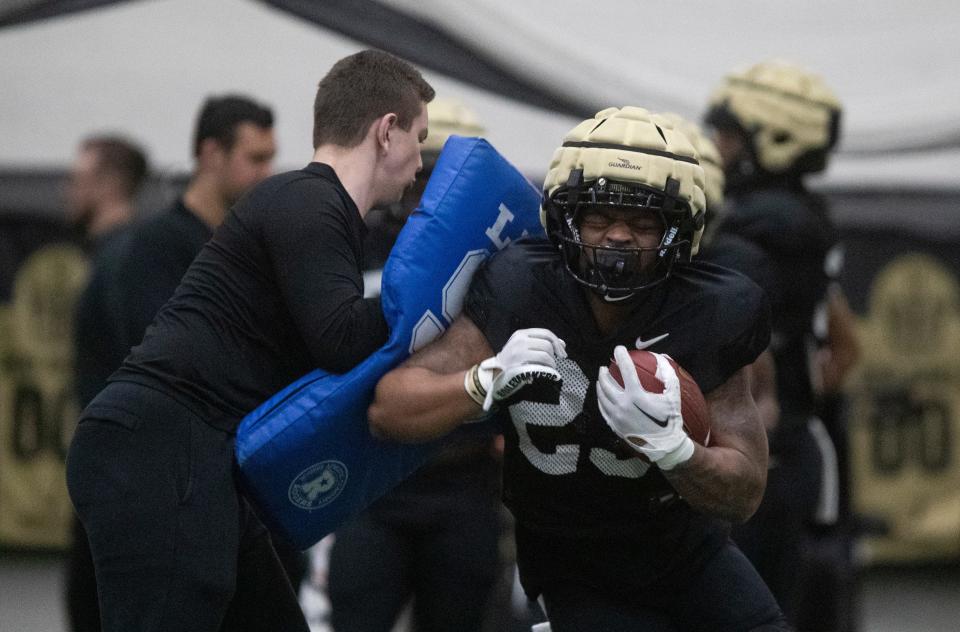 Purdue Boilermakers running back Reggie Love (23) runs a drill during practice, Tuesday, March 26, 2024, at Mollenkopf Athletic Center in West Lafayette, Ind.