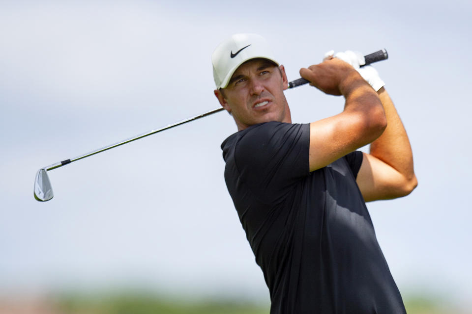 Brooks Koepka hits on the ninth hole during the first round of the 3M Open golf tournament in Blaine, Minn., Thursday, July 23, 2020. (AP Photo/Andy Clayton- King)