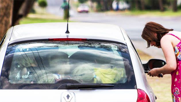 Melanie Minnie with children packed into her car. Photo: Getty