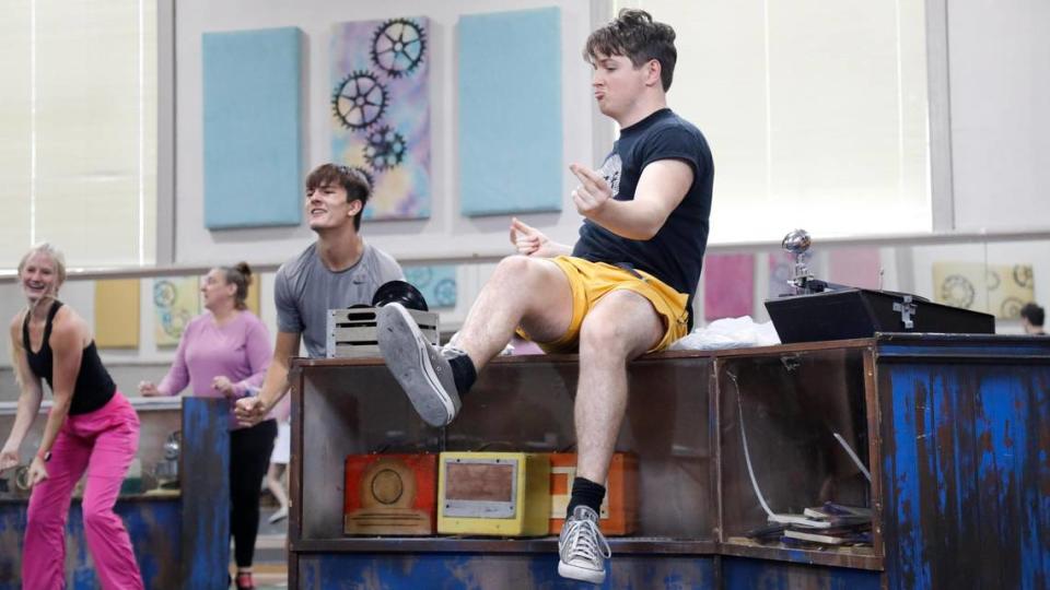 Karsen Guldan as Huey Calhoun, the other half of the inter-racial romance in “Memphis,” dances on a table on Wednesday, July 26, 2023 at Artworks at the Carver School in Lexington, Ky.