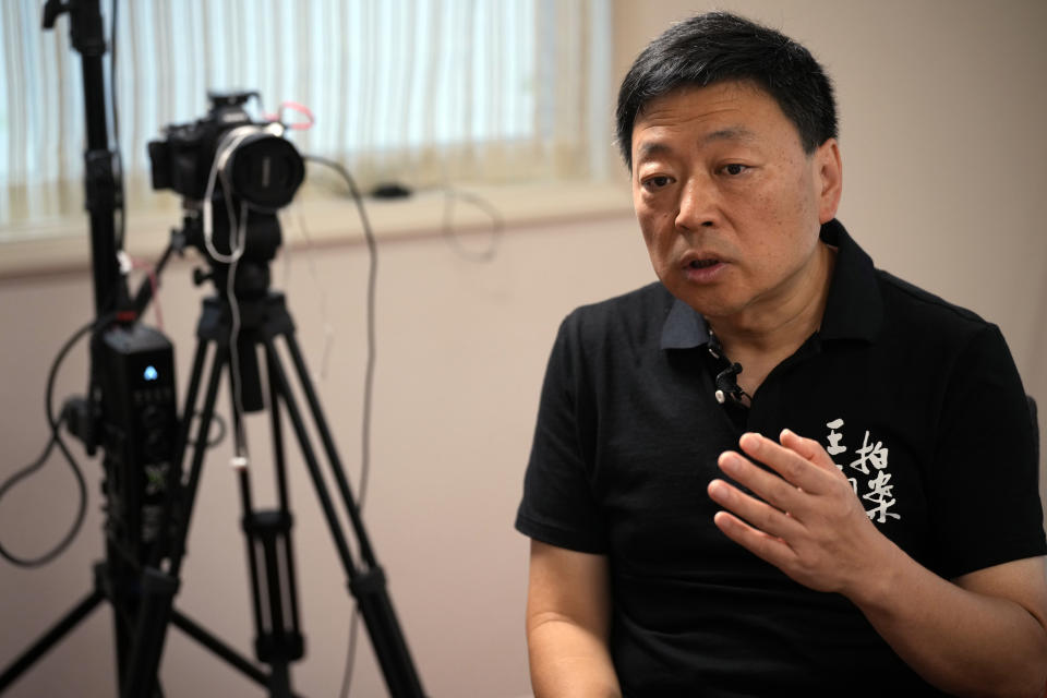 Wang Zhi'an speaks during an interview with the Associated Press in Tokyo on Oct. 5, 2022. Chinese investigative journalist Wang once exposed corruption, land seizures, and medical malpractice for state broadcaster CCTV. Today, he's in exile in Japan, and starting again as an independent journalist on YouTube. (AP Photo/Eugene Hoshiko)