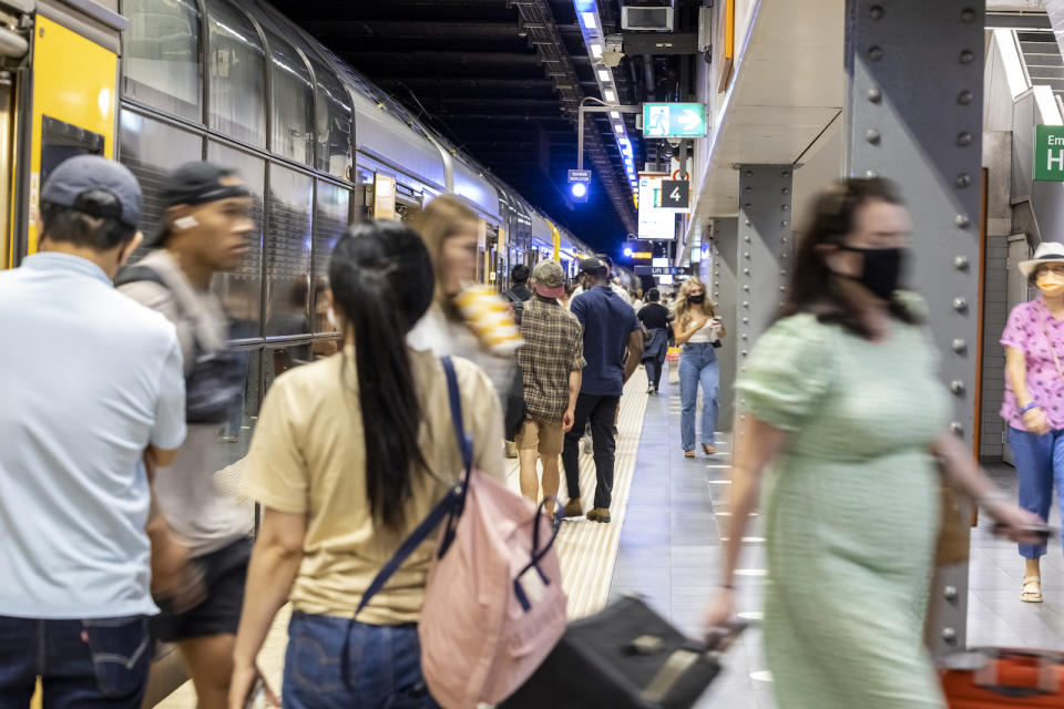 Train arrived at Town Hall subway train station with passengers getting in and out of the train