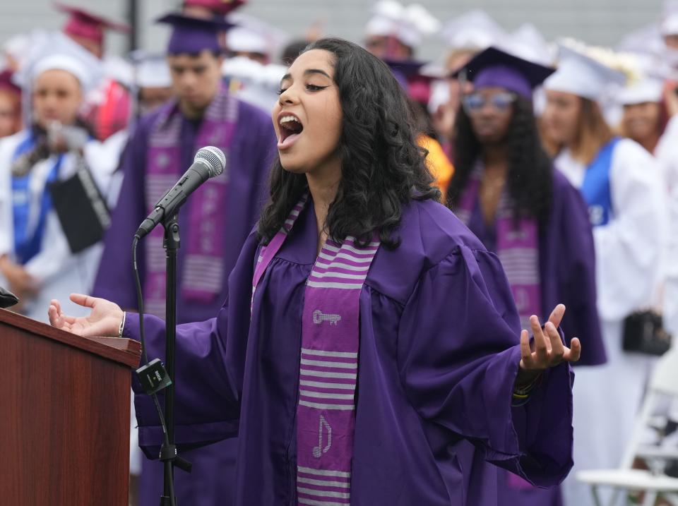 Paterson, NJ- June 27, 2023 --  Aleen Nina Ramirez of the Rosa Parks School of Performing Arts sang the national anthem. Graduations returned to  Hinchliffe Stadium where Eastside High School, Paterson P-Tech High School, Paterson STEAM High School and Rosa Parks School of Fine & Performing Arts had the first graduation at the newly renovated venue. Family, friends and faculty, all came out to honor the graduates.