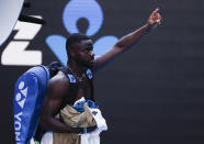 United States' Frances Tiafoe waves as he leaves the court following his second round loss to Serbia's Novak Djokovic at the Australian Open tennis championship in Melbourne, Australia, Wednesday, Feb. 10, 2021.(AP Photo/Rick Rycroft)