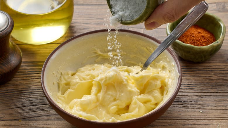 salt poured on margarine in bowl 