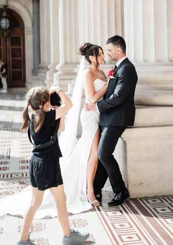 <p>Jerome Cole</p> Aisha Cole photographing bride and groom