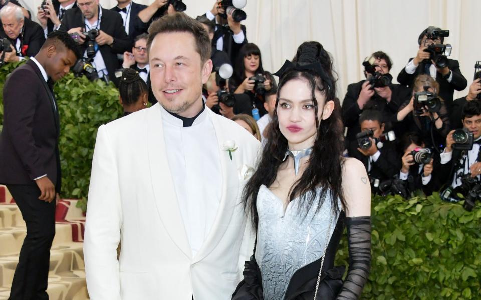 Musk with his girlfriend, the pop artist Grimes, at the Met Gala in 2018 - Neilson Barnard/Getty Images