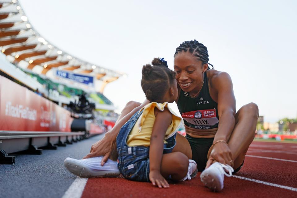 Allyson Felix celebrates with her daughter Camryn after finishing second in the women's 400 meters final at the 2020 U.S. Olympic Track & Field Team Trials.