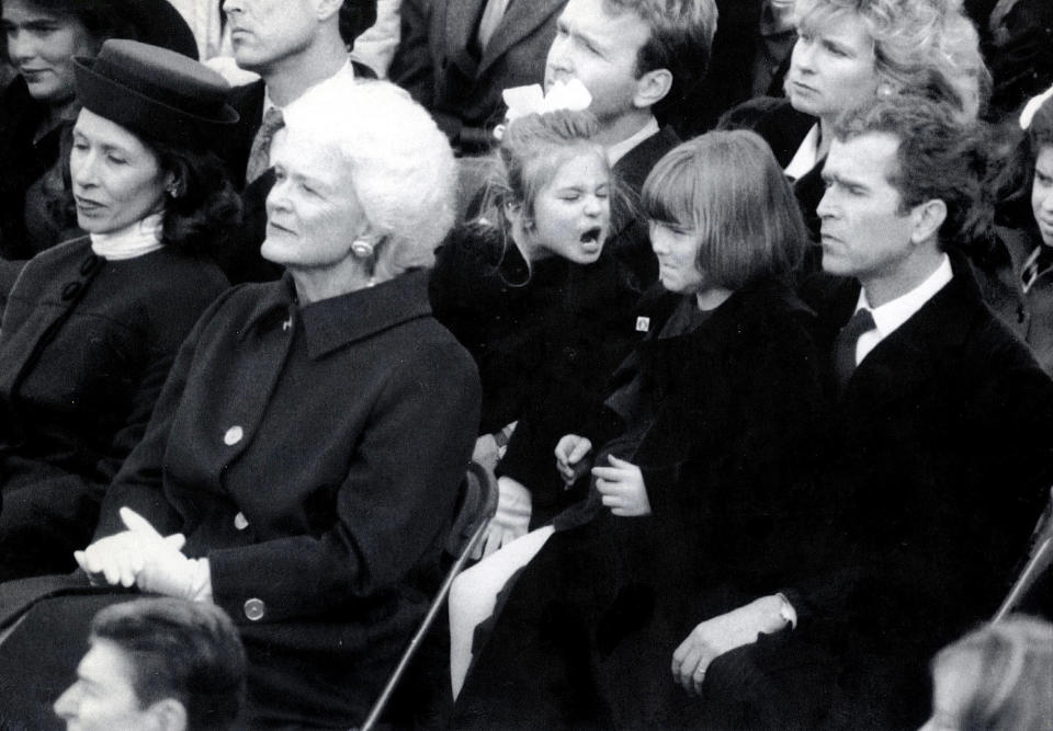 Barbara Bush (second from left) sits in front of her son George W. Bush (far right) and granddaughters Jenna (third from right) and Barbara at the presidential inauguration of George H.W. Bush in January 1989.