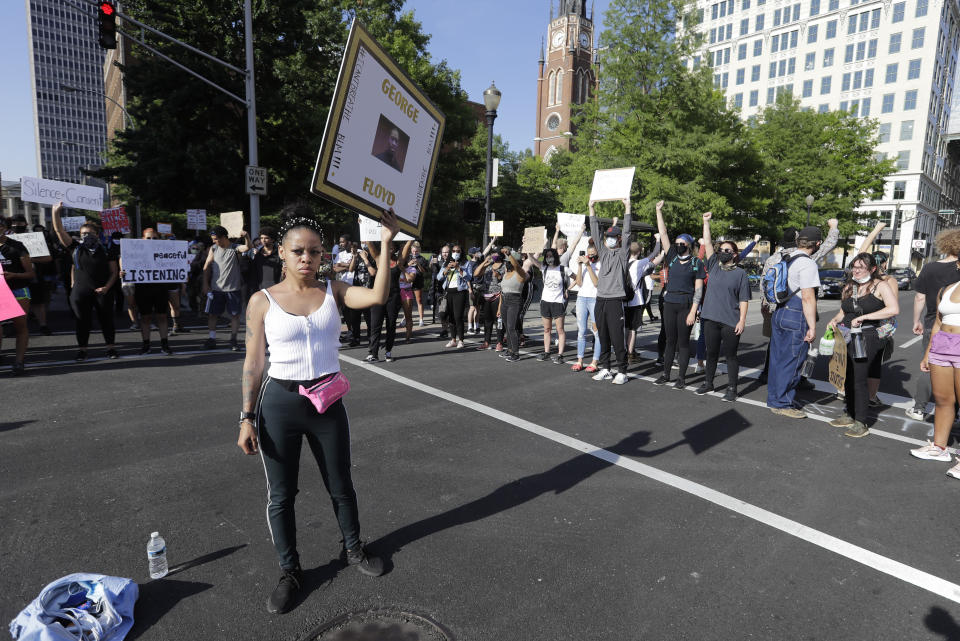 Kelly Bundy participates in a protest over the deaths of George Floyd and Breonna Taylor, Monday, June 1, 2020, in Louisville, Ky. Bundy of Louisville says most protesters are like her, peaceful people called to duty by experiences of racism and police aggression. (AP Photo/Darron Cummings)