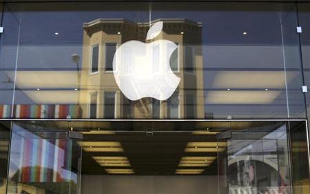 The Apple logo is pictured on the front of a retail store in the Marina neighborhood in San Francisco, California April 23, 2014. REUTERS/Robert Galbraith