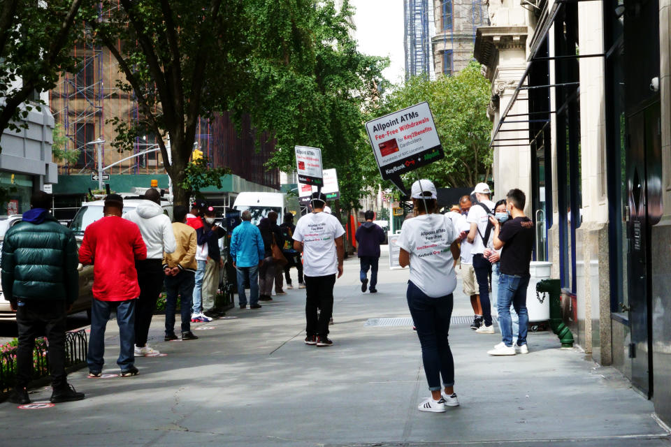 Long lines of unemployed waiting to enter bank and cash their benefit cards, Manhattan, during Coronavirus shutdown. (Photo by: Joan Slatkin/Education Images/Universal Images Group via Getty Images)