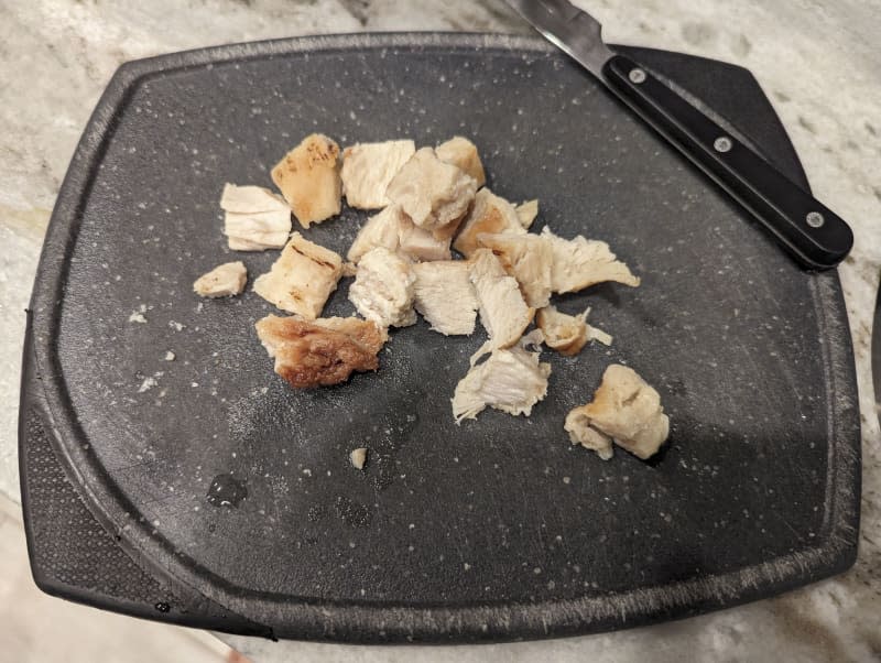 Tyson grilled and ready chicken on a cutting board.