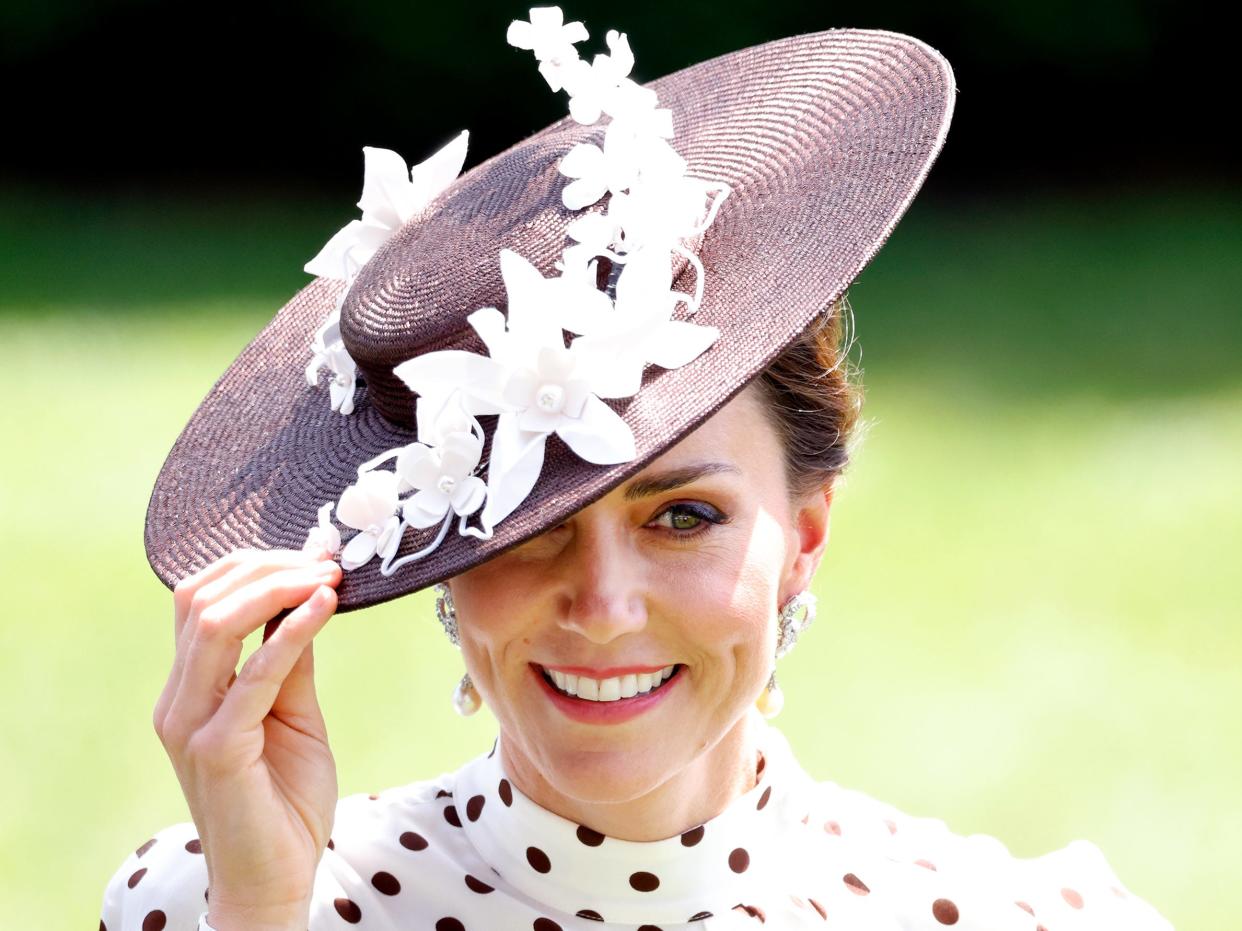 Kate Middleton touches her hat at day 4 of Royal Ascot at Ascot Racecourse on June 17, 2022 in Ascot, England.