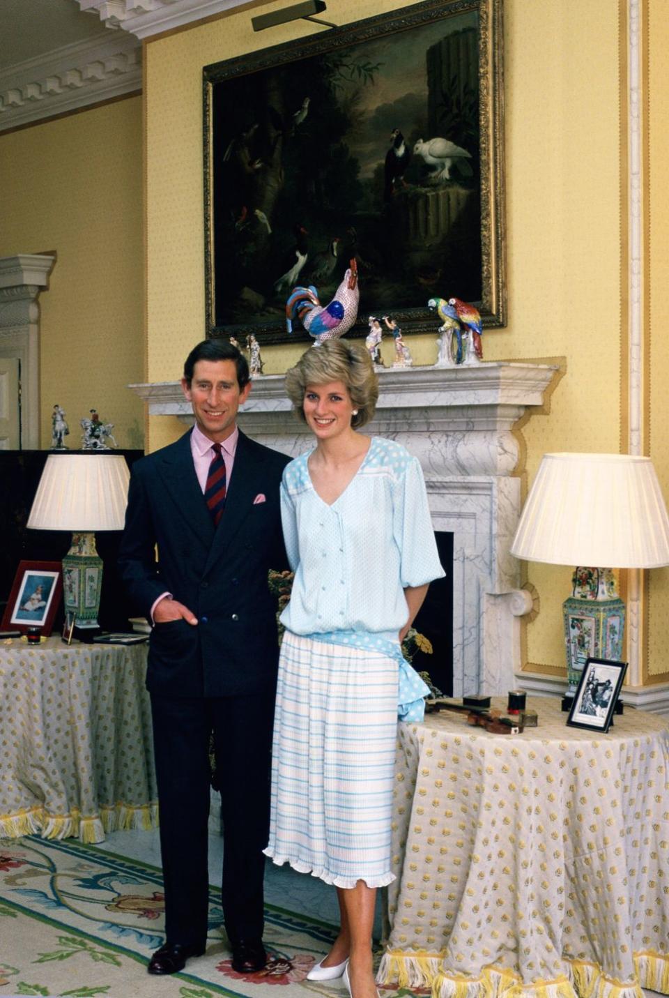 <p>The royal couple stands together for a snapshot in their home <a href="https://www.elledecor.com/design-decorate/a9195500/the-queen-is-hiring-curtain-maker/" rel="nofollow noopener" target="_blank" data-ylk="slk:at Kensington Palace;elm:context_link;itc:0;sec:content-canvas" class="link ">at Kensington Palace</a>. </p>