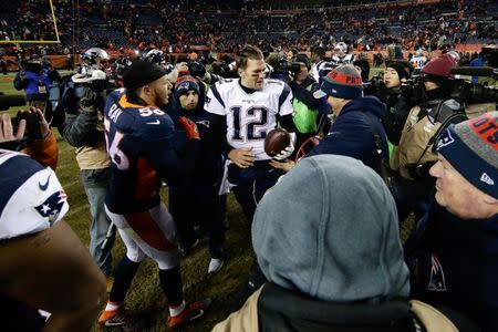 FILE PHOTO: Dec 18, 2016; Denver, CO, USA; Denver Broncos outside linebacker Shane Ray (56) greets New England Patriots quarterback Tom Brady (12) after the game at Sports Authority Field at Mile High. The Patriots won 16-3. Mandatory Credit: Isaiah J. Downing-USA TODAY Sports - 9755632