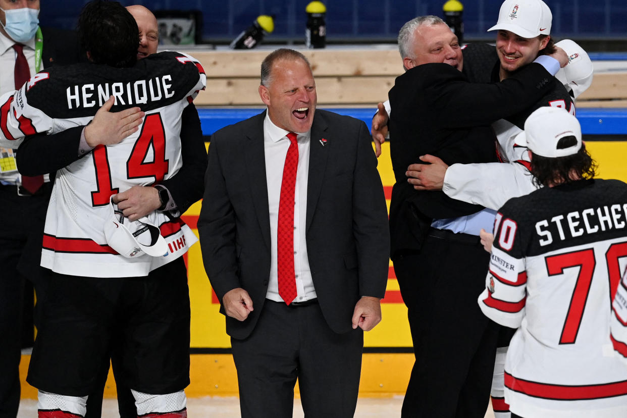 Canada's head coach Gerard Gallant (C) celebrates after his team won the IIHF Men's Ice Hockey World Championships final match between the Finland and Canada at the Arena Riga in Riga, Latvia, on June 5, 2021. - A 3-2 victory over Finland crowned Canada Ice Hockey World Champions 2021. (Photo by Gints IVUSKANS / AFP) (Photo by GINTS IVUSKANS/AFP via Getty Images)