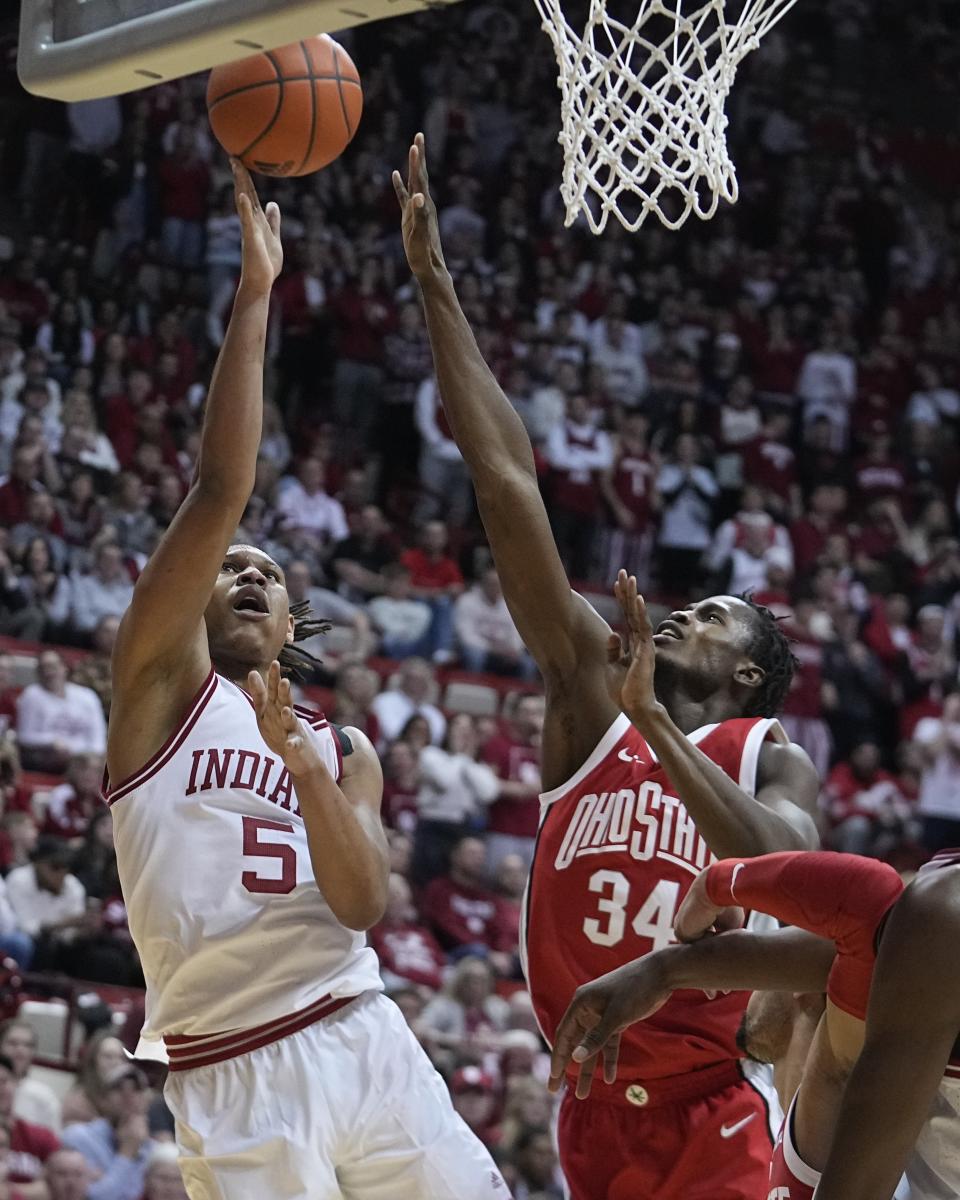 Indiana's Malik Reneau shoots over Ohio State's Felix Okpara (34) during the second half of an NCAA college basketball game, Saturday, Jan. 28, 2023, in Bloomington, Ind. (AP Photo/Darron Cummings)