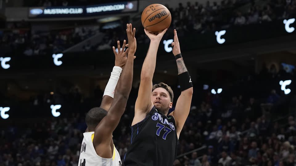 Dončić shoots as Kris Dunn defends during the first half at American Airlines Center. - Sam Hodde/Getty Images