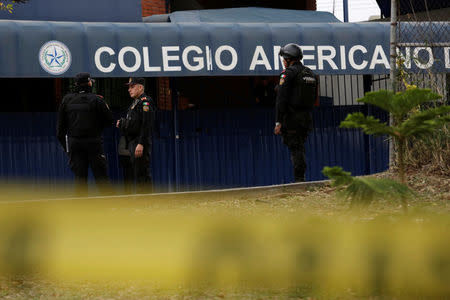 Police officers stand outside the Colegio Americano del Noreste after a student opened fire at the American school in Monterrey, Mexico January 18, 2017. REUTERS/Daniel Becerril