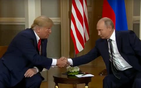 Trump and Putin shake hands ahead of talks - Credit: Sky News