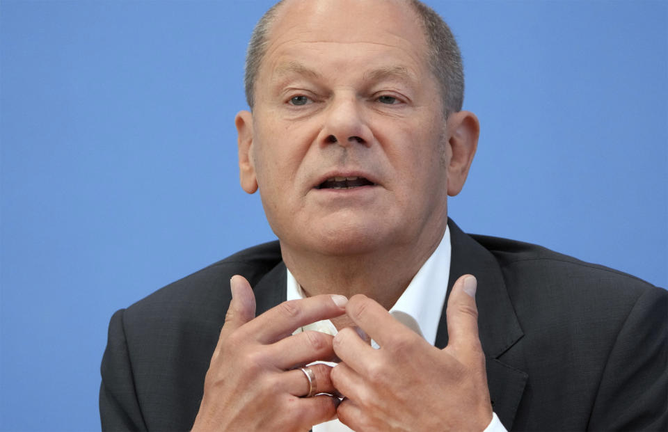 German Chancellor Olaf Scholz addresses the media during his first annual summer news conference in Berlin, Germany, Thursday, Aug. 11, 2022. (AP Photo/Michael Sohn)