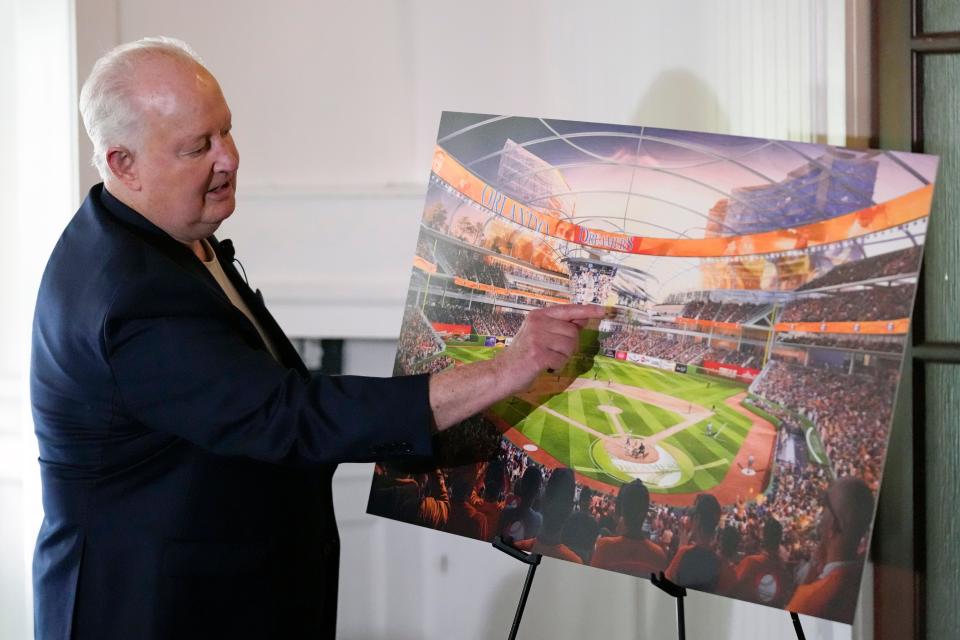Former Orlando Magic basketball executive Pat Williams unveils renderings, at a news conference, of a proposed domed stadium that he hopes will bring an MLB baseball team to Central Florida, Tuesday, May 9, 2023, in Orlando.
