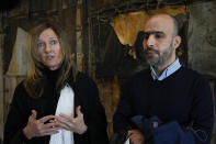 Dutch-Palestinian Ismail Ziada and his lawyer Liesbeth Zegveld, left, are interviewed after a Dutch appeals court in The Hague Tuesday, Dec. 7, 2021, upheld a lower court's decision to throw out a civil case against Israel's defense minister and another former senior military officer over their roles in a deadly 2014 airstrike in Gaza which killed six members of the Ziada family. (AP Photo/Peter Dejong)