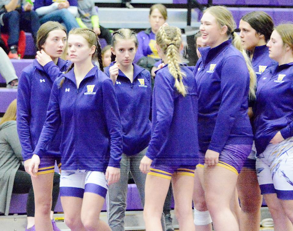 Members of the 2022-23 Watertown High School wrestling team get ready for faceoffs during a home dual this season. This was the first year the Arrows fielded a girls wrestling team since the sport was sanctioned three years ago.